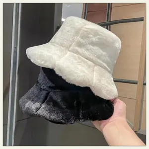 Winter faux rabbit fur bucket hats in black and white with thick plush for warm insulation