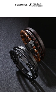 Detail of multi-layer leather bracelets with cross charm and magnetic clasp