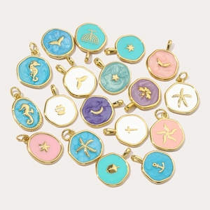 Colorful enamel ocean charms including seahorse, anchor, and cross for DIY jewelry making