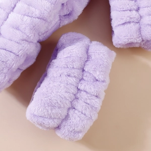 Detail of soft purple coral fleece headband with wavy plush texture for washing face