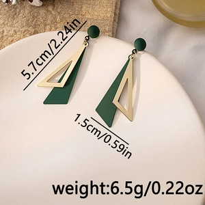 Detail view of long geometric earrings with size specs 5.7cm by 1.5cm in green and gold
