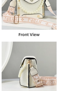 Detail view of cream woven phone bag featuring pearl handle and floral wide strap