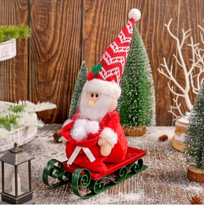 Close-up of Santa Claus on a red sleigh with knitted hat and festive wood background