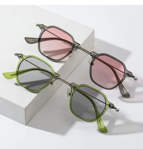 Detail of mechanical gear hinge on stylish small frame sunglasses with metal accents