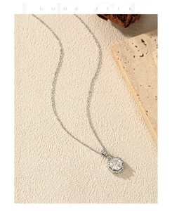Close-up of hexagonal S925 silver pendant necklace with sparkling cubic zirconia stone