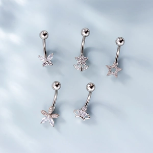 Surgical steel belly rings set with butterfly and flower cubic zirconia charms