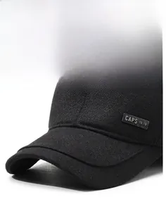 Macro view of black baseball cap showing herringbone texture and metal side badge detail