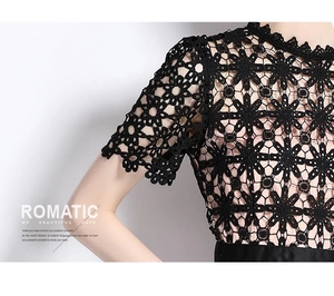 Gros plan sur la dentelle florale noire brodée et les détails de crochet ajourés