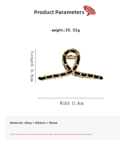 Detail view of gold alloy hair claw clip with black ribbon weaving and size measurements
