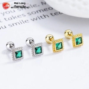 Detail of square green emerald screw-back earrings in gold and silver plating