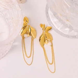 Elegant gold leaf earrings with pearl tassels and star charms on a white background
