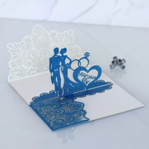 Lace laser-cut 3D wedding invitation card featuring blue glitter Mr & Mrs silhouette