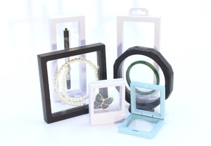 Multiple colorful PE film floating display frames showing 3D suspended jewelry storage