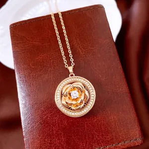 Vintage gold rose spinning flower pendant necklace with zircon and leather backdrop