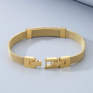 Close-up of golden mesh stainless steel bracelet with Milanese weave and mechanical clasp