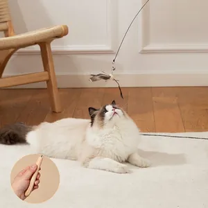 Extra long cat feather toy with natural wooden handle and bell for interactive playing