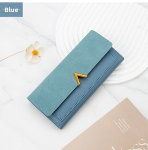 Detail of teal and blue long wallet with matte finish and elegant V-shaped metal buckle