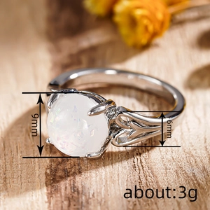 Minimalist white opal heart-hollow silver ring with 9mm stone and natural wooden background