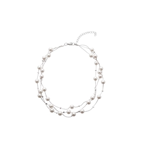 French style multi-layer pearl necklace with silver chain on white background