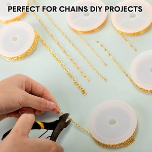 Close-up of cutting gold-plated DIY jewelry chains with pliers on blue background