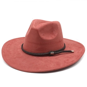 Detail of brick red suede fedora showing the dark brown braided band and metal fastener