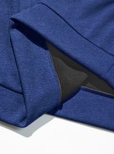 Macro shot of navy blue knit hoodie showing thick double-layered fabric and stitching