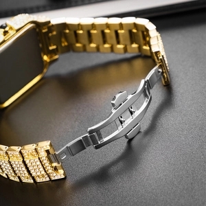 Close-up of the silver butterfly clasp on a gold iced-out diamond watch band