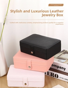 Three-tier stack of leather jewelry boxes with snap closures in assorted elegant colors