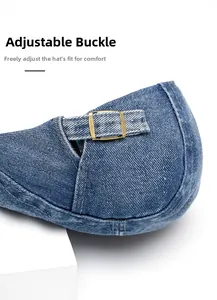 Detail of adjustable brass buckle and denim strap on a vintage newsboy cap