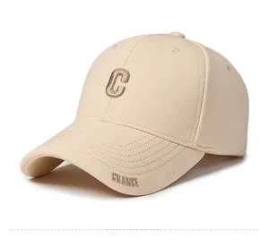 Detail of breathable cream mesh fabric and premium 3D brown letter embroidery on the cap