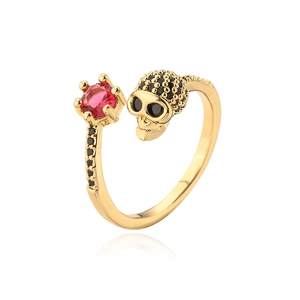 Gothic punk skull ring with red gemstone and black micro zircons in gold plating