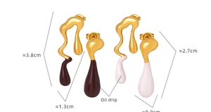 Detailed size view of asymmetric gold drip earrings with brown and white oil finish