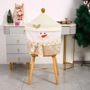 Detail view of a plush snowman chair cover with a sequined scarf for Christmas decor