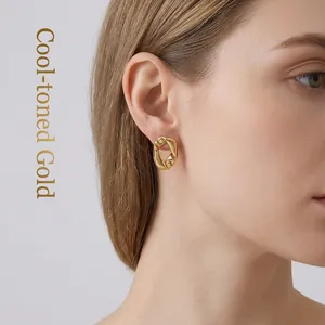 Boucles d'oreilles géométriques irrégulières en acier titane plaqué or 18 carats