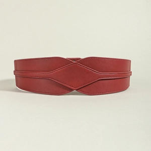 Close-up of a wide dark red elastic waist belt featuring diamond patterns and stitching
