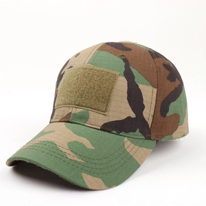 Close-up of tactical woodland camouflage baseball cap featuring a front Velcro patch area