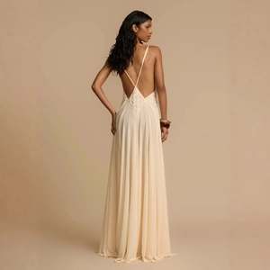 Elegant white backless maxi dress with delicate lace patchwork and criss-cross straps