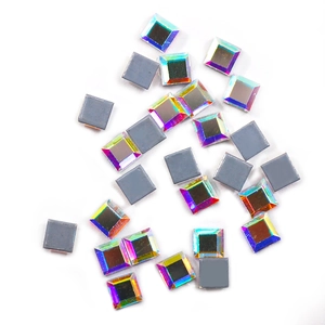 Macro view of square K9 crystal rhinestones with iridescent AB finish and grey flat back