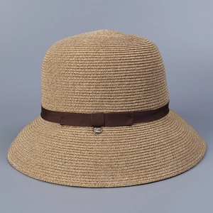 Detail view of a Japanese-style breathable plant fiber sun hat with dark brown ribbon.