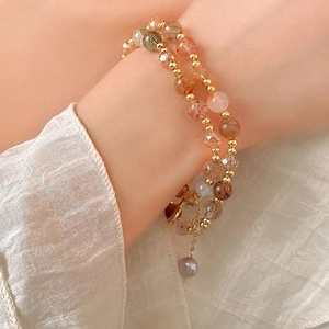 Double-layer crystal beaded bracelet with gold accents and a freshwater pearl charm