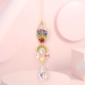 Detail of life tree crystal suncatcher with golden crescent moon and star window decor