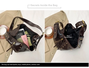 Innenansicht einer braunen Vintage-Leder-Schultertasche mit großem Fassungsvermögen und Nieten