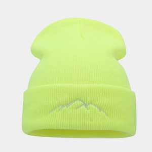 Close-up of mountain peak embroidery on a neon green ribbed knit beanie hat