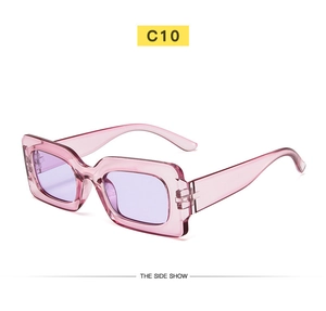 Detail view of translucent pink rectangle sunglasses with purple lenses and C10 model logo