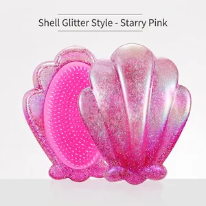 Shell shaped hairbrush in starry pink with glitter finish and iridescent coating