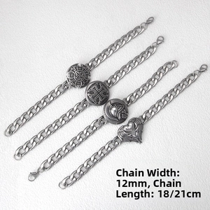 Detail of 12mm wide Cuban chain bracelets with vintage silver charms in Viking style