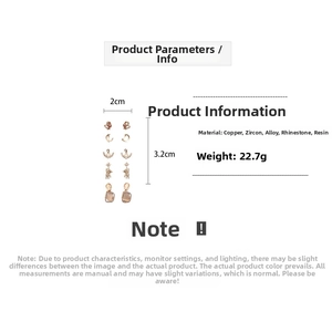 Detail of rose gold earring set featuring zirconia moon and star designs with measurements