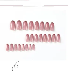 Detail view of 24 pieces pink glitter gradient press-on nails in long oval shape