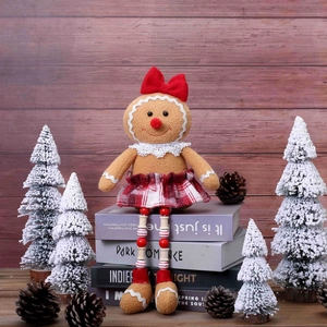 Gingerbread man gnome plush with long legs sitting on books in a cozy Christmas setting
