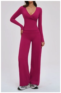 Deep magenta two-piece lounge set with V-neck wrap top and wide leg high-waisted pants